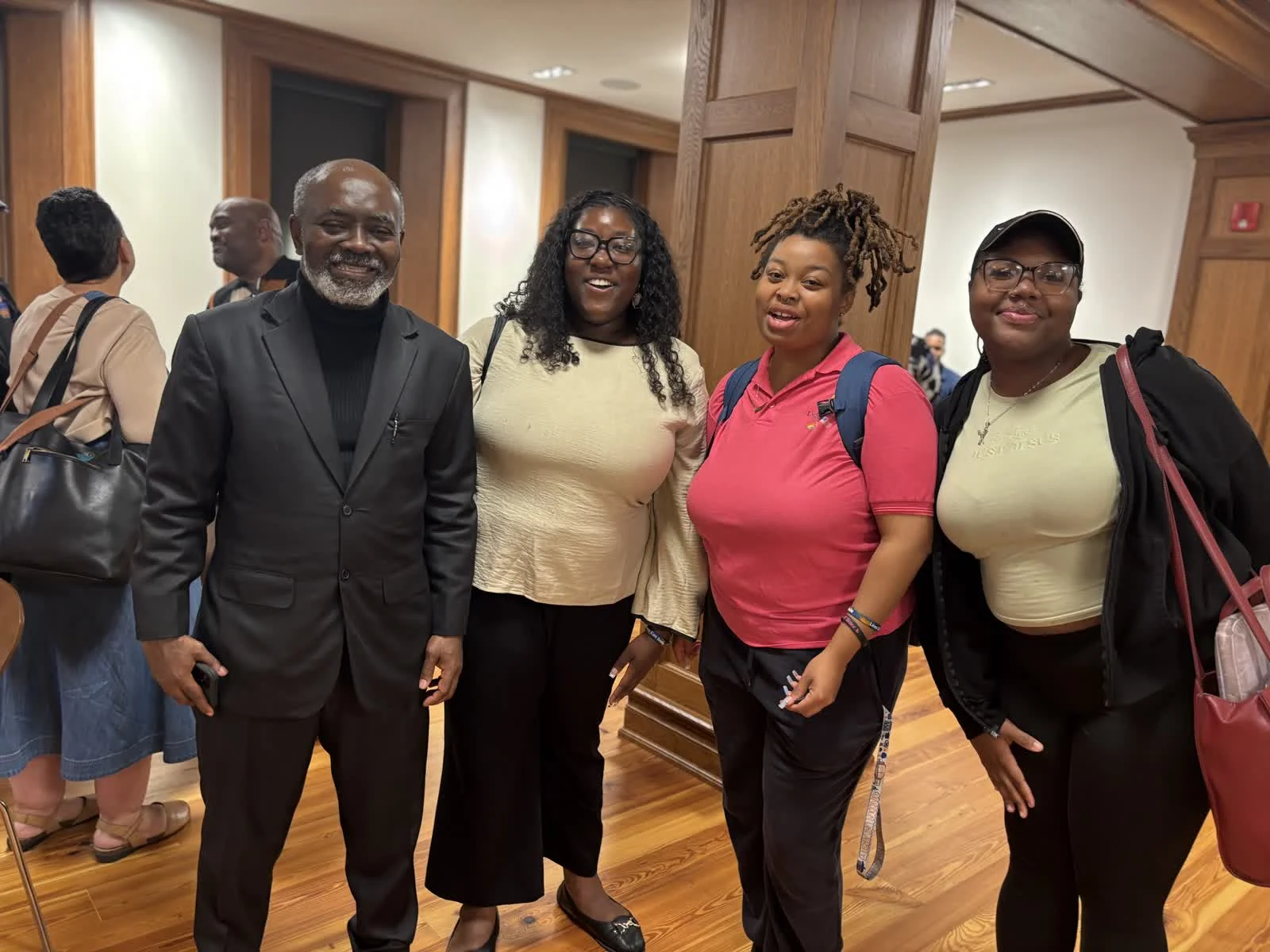 Dr. Lagoke with Ava Edwards, Simone Taylor and Dayana, students.