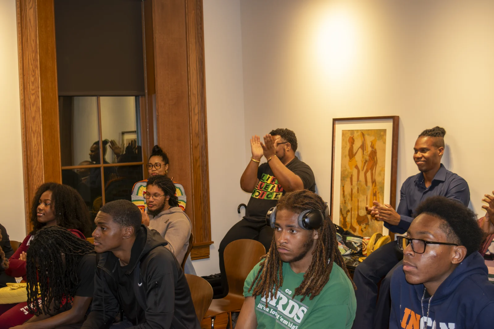 A participant speaks from the audience