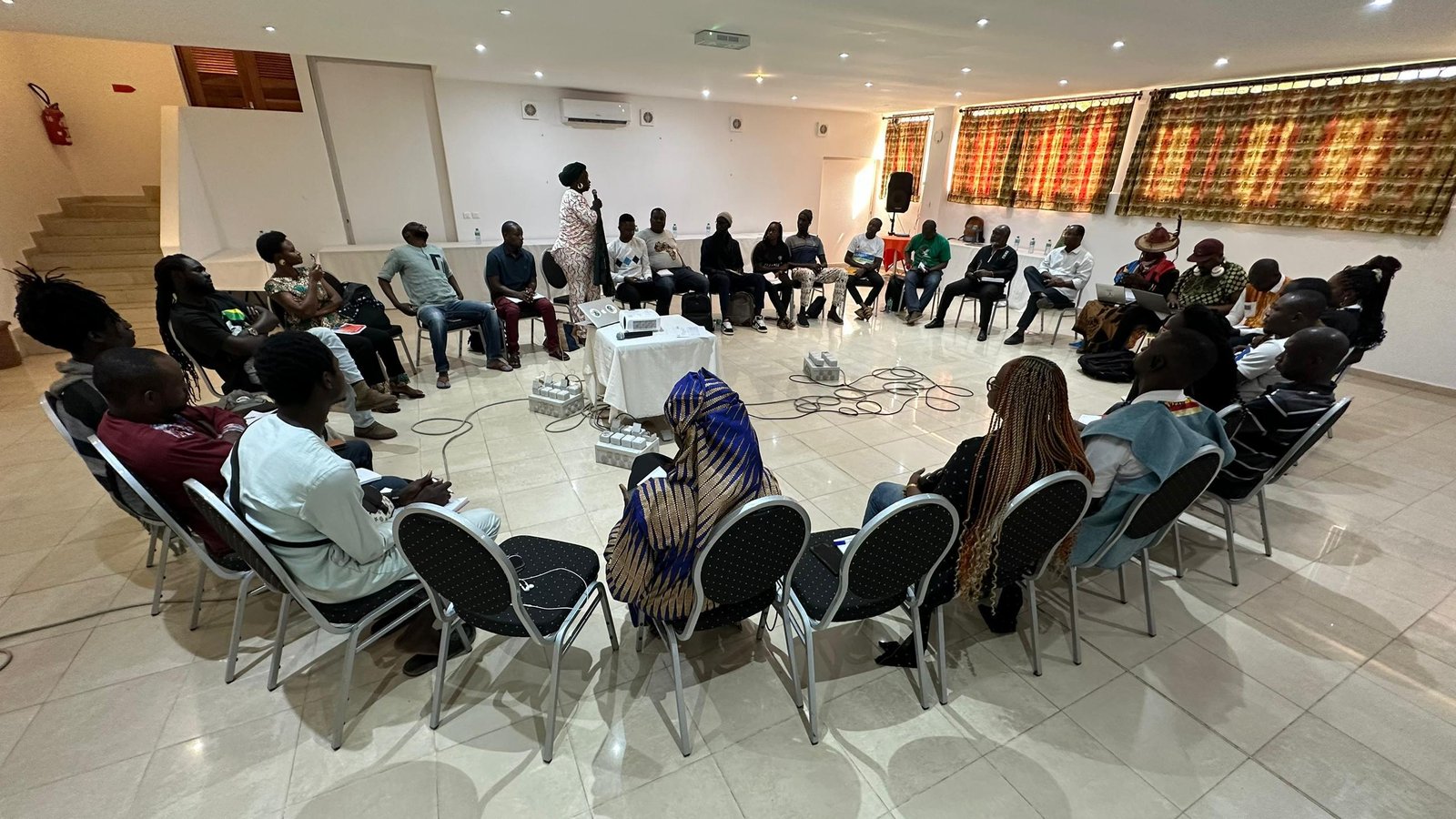 Participants seated in a large circle during an Ubuntu workshop